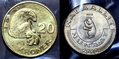 20 Kroner coin showing a polar bear and cub with value.
with the obverse of the 5 Kroner featuring country name in Greenlandic (KALAALLIT NUNAAT), a standing polar bear, and the year.