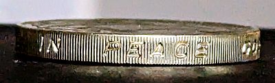 Thick edge of the coin, reeded and with the word PEACE visible. The full text is "1945 IN PEACE GOODWILL 1995"