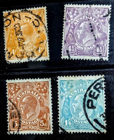 Four King George V stamps closeup.