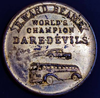 B. WARD BEAM'S / WORLD'S / CHAMPION / DAREDEVILS / (car jumping over bus)