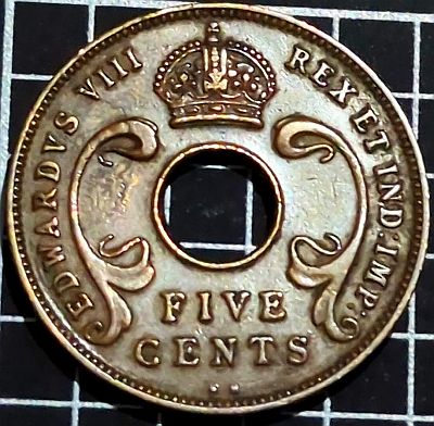 Central hole divides crown and denomination surrounded by legend Script: Latin Lettering: EDWARDVS VIII REX ET IND:IMP: FIVE CENTS