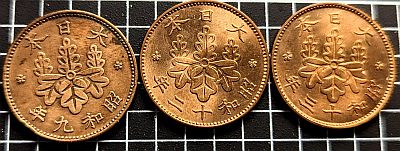 Reverse of three 1 Sen coins from different years.