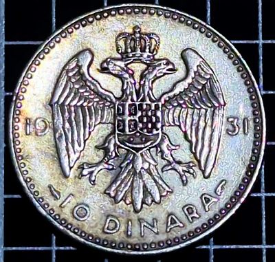 Coat of arms of Yugoslavia, denomination below Script: Latin Lettering: 19 31 10 DINARA Engraver: Percy Metcalfe