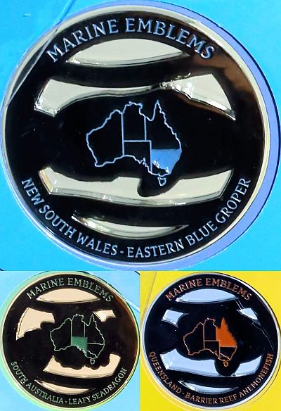 Reverse of the three medallions with text as on the front (title top, state and emblem below), map of Australia in the centre with the particular state shaded. NSW top (blue), SA lower-left (green), QLD lower-right (orange)