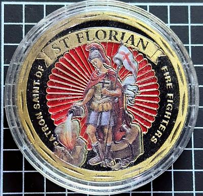 Text "SAINT FLORIAN" and "Patron Saint of Fire Fighters" around the edge. In the centre is a traditional image of Saint Florian pouring water out of a bucket onto buildings.