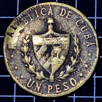 Obverse Cuban coat of arms, country name as curved legend on top, face value in letters as curved legend on bottom. Line of denticles close to rim. Script: Latin Lettering: REPUBLICA DE CUBA UN PESO Translation: Republic of Cuba One Peso Engraver: Charles Edward Barber