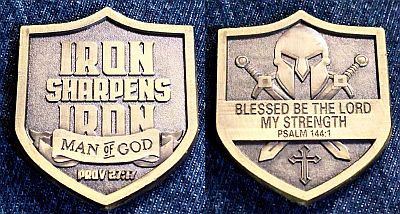 Shield-shaped medallion with, on one side: "Iron sharpens Iron", "Man of God" with the attribution to Prov 27:17.

On the other side, a helmet and crossed swords behind "Blessed be the lord my strength" and the attribution Psalm 144:1