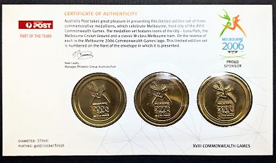 Reverse of the inner card showing the back of the medallions and a certificate of authenticity