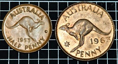 1953 Half Penny next to 1963 Penny, reverse showing on both. Half Penny reverse: Kangaroo leaping right Script: Latin Lettering: AUSTRALIA KG 1953 HALF PENNY Engraver: George Kruger Gray Penny reverse: Kangaroo above date and value. Script: Latin Lettering: AUSTRALIA KG 1956 PENNY. Engraver: George Kruger Gray Designer: George Kruger Gray