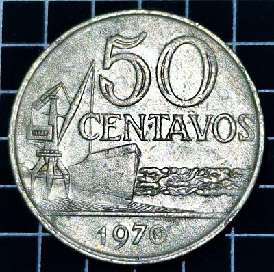 Reverse A docked cargo ship and a crane left, representing the shipping industry, value and date. Script: Latin Lettering: 50 CENTAVOS 1970 Engraver: Benedicto de Araújo Ribeiro Designer: Benedicto de Araújo Ribeiro