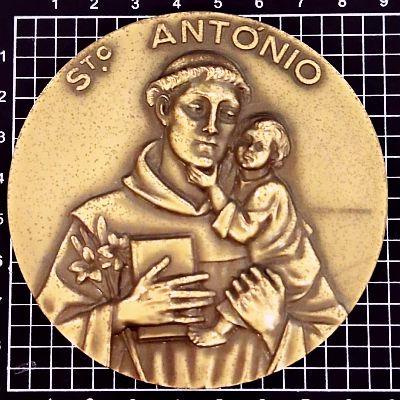 90mm brass medal. Text around top: St. ANTONIO / (Saint Anthony holding child and bible) / CABRAL ANTUNES